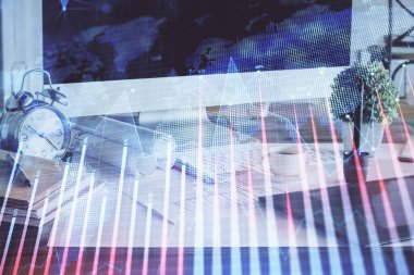 Arka planda eski pazar grafik hologramı ve kişisel bilgisayar var. Çoklu maruz kalma. Yatırım kavramı.