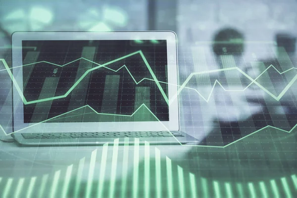 stock image Stock market graph on background with desk and personal computer. Multi exposure. Concept of financial analysis.