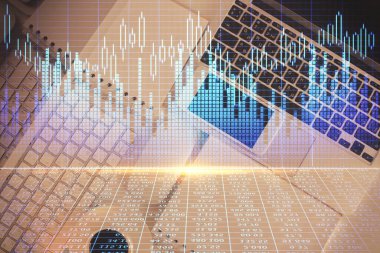 Finans piyasası grafiği ve masaüstü bilgisayarının üst görüntüsü. Çoklu maruz kalma. Yatırım kavramı.