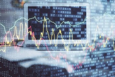 Finansal tablo çizimi ve arka planda bilgisayar olan bir tablo. Çoklu maruz kalma. Uluslararası pazarlar kavramı.