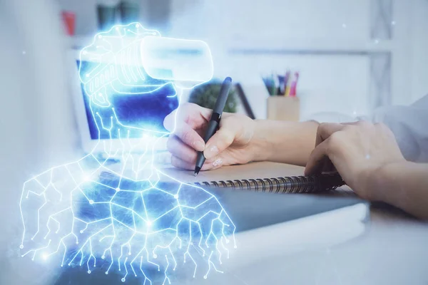 AR hologram over woman\'s hands taking notes background. Concept of augmented reality. Multi exposure