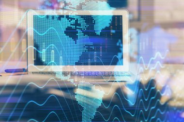 Finansal tablo çizimi ve arka planda bilgisayar olan bir tablo. Çoklu maruz kalma. Uluslararası pazarlar kavramı.