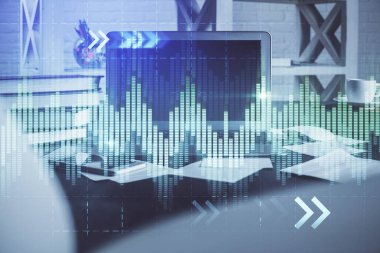 Finansal tablo çizimi ve arka planda bilgisayar olan bir tablo. Çoklu maruz kalma. Uluslararası pazarlar kavramı.