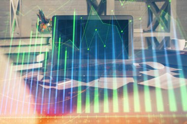 Finansal tablo çizimi ve arka planda bilgisayar olan bir tablo. Çoklu maruz kalma. Uluslararası pazarlar kavramı.