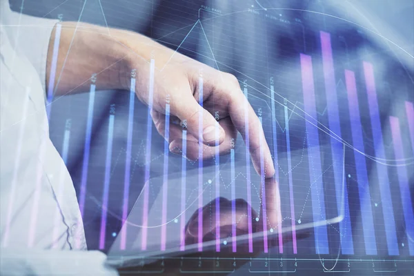 stock image Double exposure of man's hands holding and using a digital device and forex graph drawing. Financial market concept.