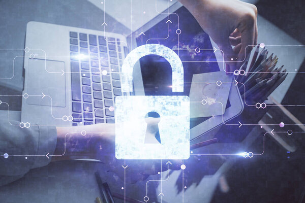 Double exposure of woman hands working on computer and lock hologram drawing. Security concept.