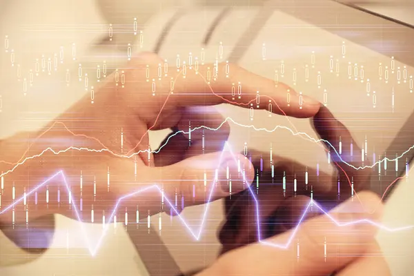 stock image Multi exposure of man's hands holding and using a phone and financial chart drawing. Market analysis concept.