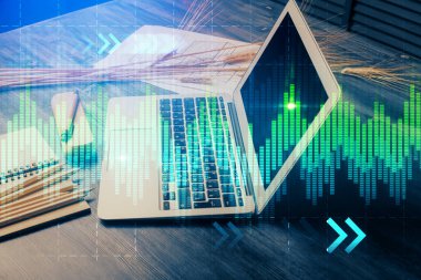 Finansal grafik renkli çizimler ve arka planda bilgisayar olan tablolar. Çifte maruziyet. Uluslararası pazarlar kavramı.