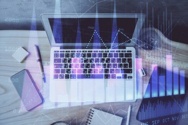 Finansal grafik renkli çizimler ve arka planda bilgisayar olan tablolar. Çifte maruziyet. Uluslararası pazarlar kavramı.