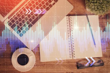 Finans piyasası grafiği ve masaüstü bilgisayarının üst görüntüsü. Çifte maruziyet. Yatırım kavramı.