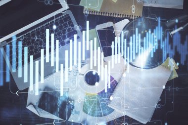 Finans piyasası grafiği ve masaüstü bilgisayarının üst görüntüsü. Çifte maruziyet. Yatırım kavramı.