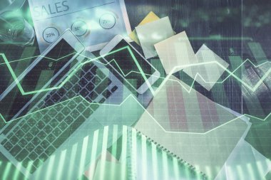 Finans piyasası grafiği ve masaüstü bilgisayarının üst görüntüsü. Çoklu maruz kalma. Yatırım kavramı.