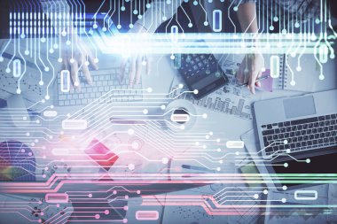 Kadın ve erkeğin birlikte çalışması ve veri temalı hologram çizimi. Bilgisayar arkaplanı. Üst Görünüm.