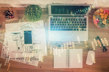 Bilgisayarla birlikte çok sayıda finansal şema çizimi. Araştırma kavramı. Üst görünüm.