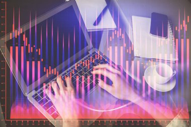 Bilgisayarda ve ön x grafik hologram çiziminde kadın eli yazarken çift pozlama. Borsa yatırım kavramı.