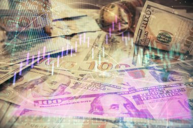 Forx grafiğinin çok sayıda görüntüsü bize dolar banknotları arka planında görünüyor. Finansal başarı piyasası kavramı.