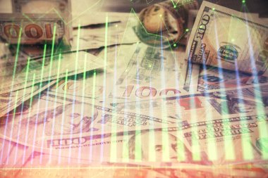 Forx grafiğinin çok sayıda görüntüsü bize dolar banknotları arka planında görünüyor. Finansal başarı piyasası kavramı.