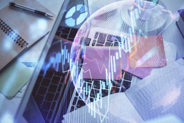 Bilgisayarla birlikte çok sayıda finansal şema çizimi. Araştırma ve analiz kavramı. Üst görünüm.