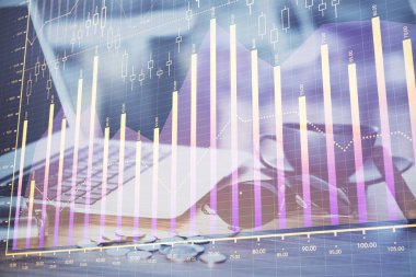 Finansal pazar grafiği hologramı ve kişisel bilgisayar arka planda. Çifte maruziyet. Önx kavramı.