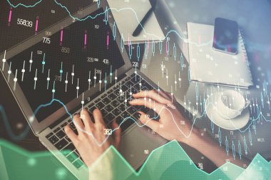 Bilgisayarda ve ön x grafik hologram çiziminde kadın eli yazarken çift pozlama. Borsa yatırım kavramı.