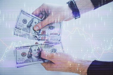 Finansal grafiğe çoklu pozlama hologram, Amerikan dolarları ve insan eli. Analiz kavramı.