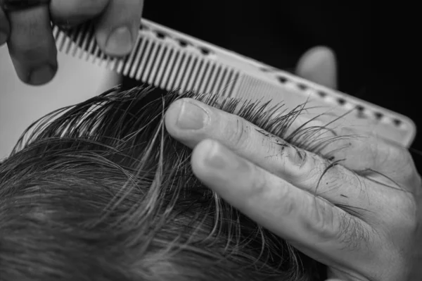 close up haircut, scissors and comb. Selective focus