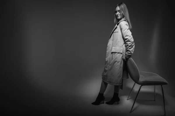 Young Pretty Emotional Girl Gray Raincoat Standing Chair Leaning White — Stock Photo, Image