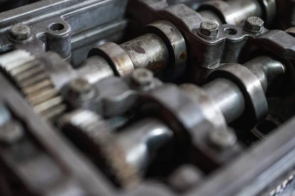 stock image Close-up of a disassembled, engine, part of the automatic transmission box of a car on a machine in a garage or repair factory station for repair or maintenance. Detail. Close up view