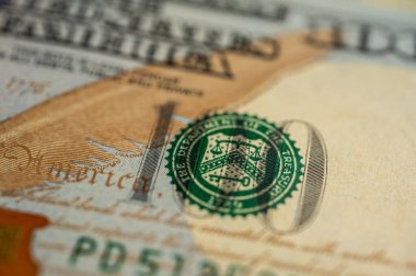 Close-up view of a $100 U.S. dollar bill, highlighting intricate details, security features, and vibrant colors. Perfect for themes of finance, banking, and wealth representation clipart