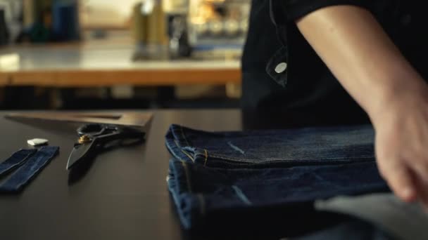 Female Tailor Seamstress Marking Hem Pair Old Vintage Jeans Workshop — Stock Video