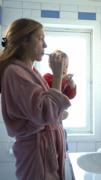 Young Mother Her Baby Brushing Teeth Together Morning Bathroom — Stock Video