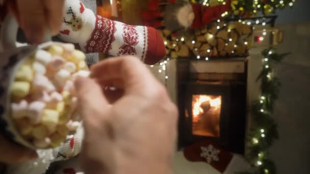 Couple Enjoying Warm Fireplace Warming Feet Woolen Socks Christmas Ornaments — Stock Video