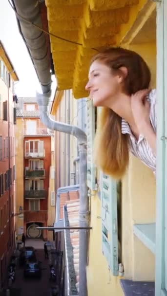 Young Woman Looking Out Window Medieval Street Smiling Waving Her — Stock Video