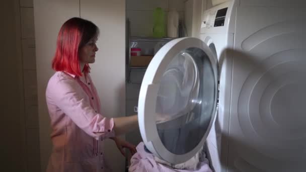 Young Woman Dyed Red Hair Loading Dirty Clothes Washing Machine Royalty Free Stock Footage