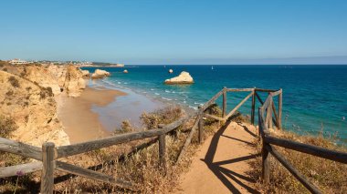 Beautiful view of limestone rocks on the Praia dos Tres Castelos. Portimao city, Portugal