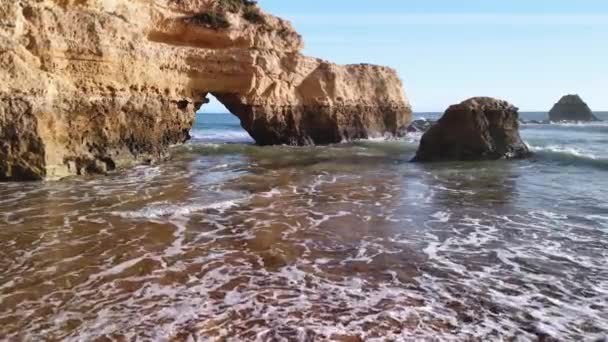 View Sailing Boat Natural Limestone Arc Waves Crashing Rocks — Stock Video