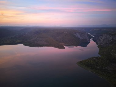 Vivid colorful sunset above Visovacko Lake in Krka National Park, Croatia clipart