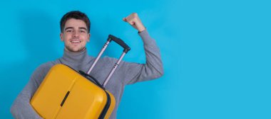 isolated young man with suitcase
