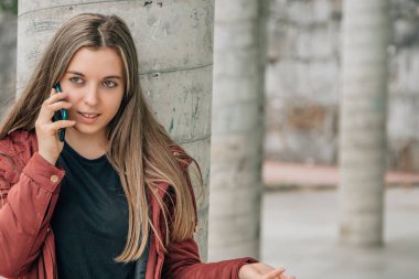 girl talking on mobile phone in the street