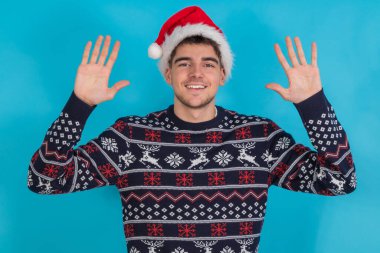 isolated young man with christmas clothes