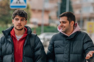 friends on the street talking