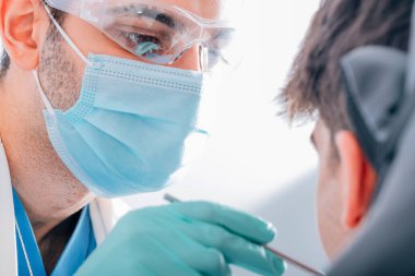 dentist working with patient, oral health