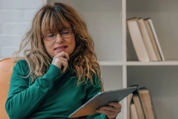 stock image woman at home with tablet or laptop