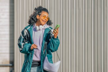 girl on the street with mobile phone or smartphone