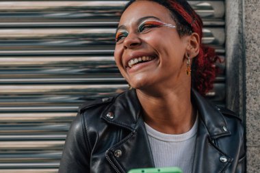 portrait of girl on the street with mobile phone