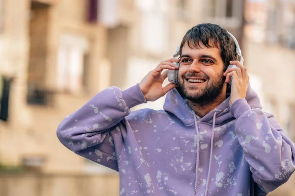 Young Man Enjoying Listening Music Headphones Outdoors — стокове фото