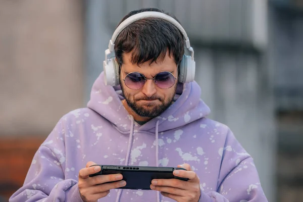 Man Playing Online Device Headphones — стокове фото
