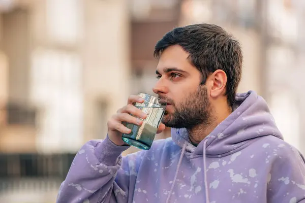 Young Man Drinking Glass Water Stock Image