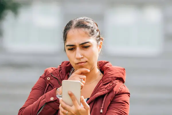 Girl Looking Pensively Mobile Phone — Stock Photo, Image