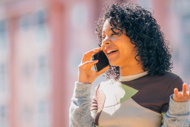 girl talking on mobile phone in the street